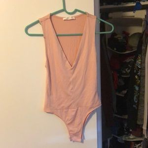 Pink low cut body suit